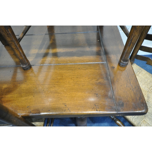 1204 - A GOOD QUALITY REPRODUCTION SOLID OAK REFECTORY TABLE, on block and turned legs, united by a H stret... 