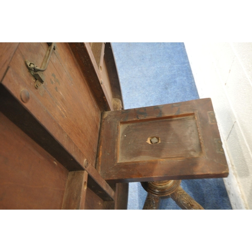 1207 - A 19TH CENTURY WALNUT AND INLAID OVAL TILT TOP LOO TABLE, on a bulbous turned support and four splay... 