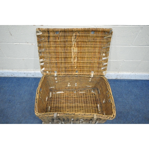 1208 - A WICKER BASKET, with a hinged lid and two closing belts, width 81cm x depth 54cm x height 58cm (con... 