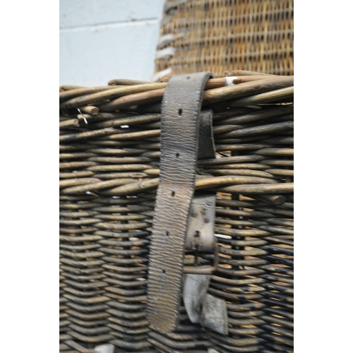 1208 - A WICKER BASKET, with a hinged lid and two closing belts, width 81cm x depth 54cm x height 58cm (con... 