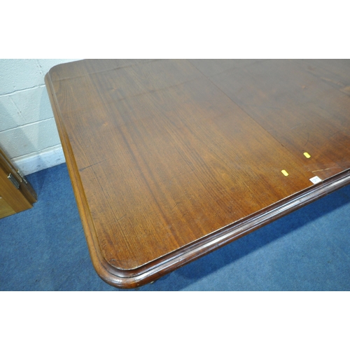 1217 - A VICTORIAN MAHOGANY EXTENDING PULL-OUT DINING TABLE, with three additional leaves, on turned legs a... 