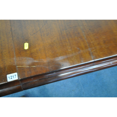 1217 - A VICTORIAN MAHOGANY EXTENDING PULL-OUT DINING TABLE, with three additional leaves, on turned legs a... 