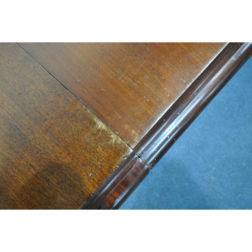 1217 - A VICTORIAN MAHOGANY EXTENDING PULL-OUT DINING TABLE, with three additional leaves, on turned legs a... 