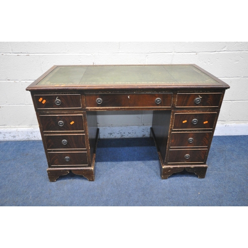 1218 - A 20TH CENTURY MAHOGANY TWIN PEDESTAL DESK, with green tooled leather writing surface, fitted with e... 