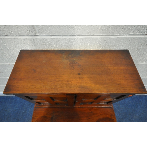 1220 - AN EARLY 20TH CENTURY MAHOGANY DAVENPORT, fitted with a double door top section, enclosing four draw... 