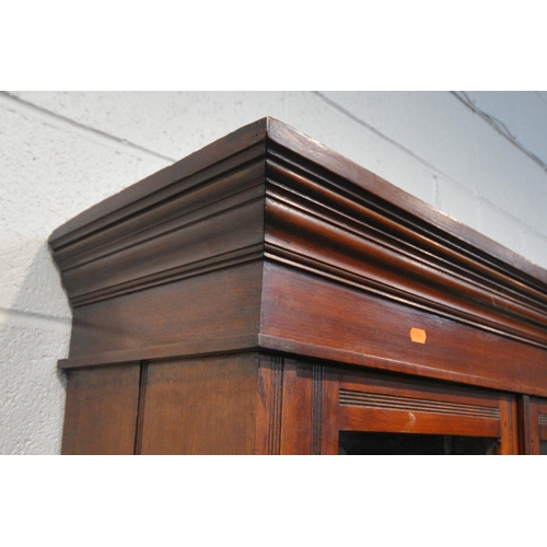 1227 - A 20TH CENTURY MAHOGANY BOOKCASE, fitted with double glazed doors and double cupboard doors, enclosi... 