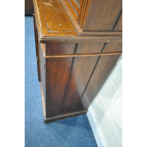 1227 - A 20TH CENTURY MAHOGANY BOOKCASE, fitted with double glazed doors and double cupboard doors, enclosi... 