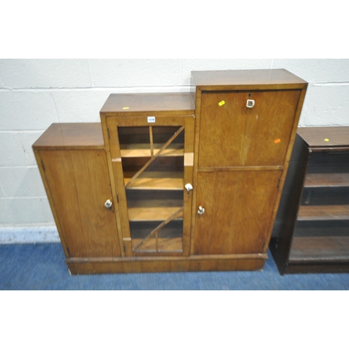 1228 - A MID CENTURY STEPPED BOOKCASE, fitted with two cupboard doors, one glazed door and a fall front doo... 