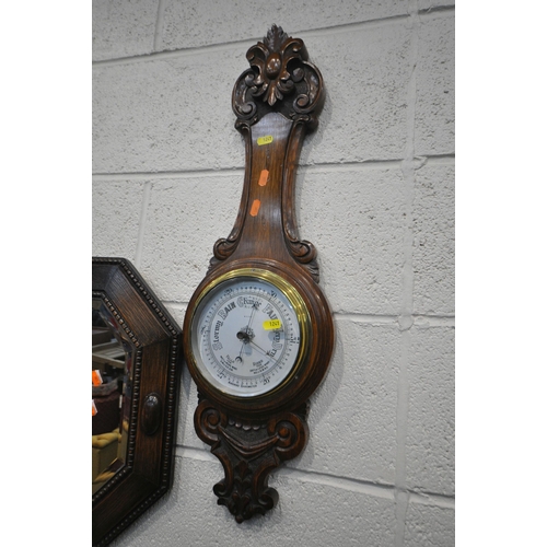 1241 - AN OAK FRAMED BEVELLED EDGE WALL MIRROR, 69cm x 46cm, and an oak aneroid barometer (condition report... 