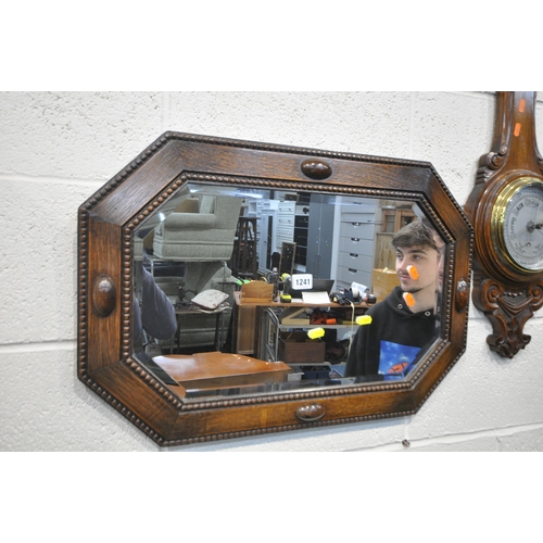 1241 - AN OAK FRAMED BEVELLED EDGE WALL MIRROR, 69cm x 46cm, and an oak aneroid barometer (condition report... 