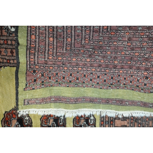 1256 - THREE PATTERNED WOOL RUGS, the largest rug with a repeating border, central medallions with a tan bo... 