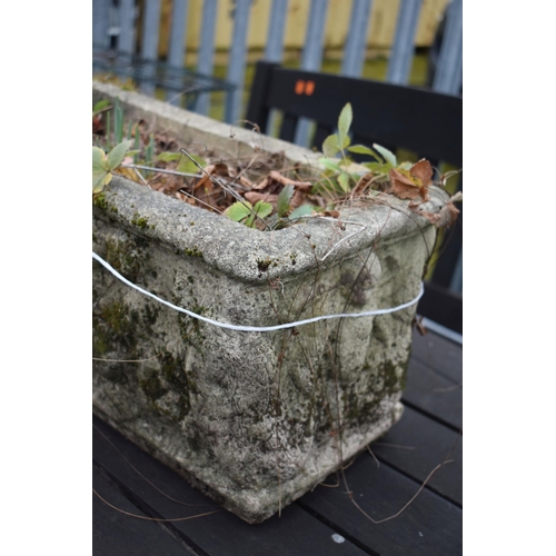 1003 - A WEATHERED COMPOSITE RECTANGULAR PLANTER, depicting putto to the sides, length 54cm (condition repo... 