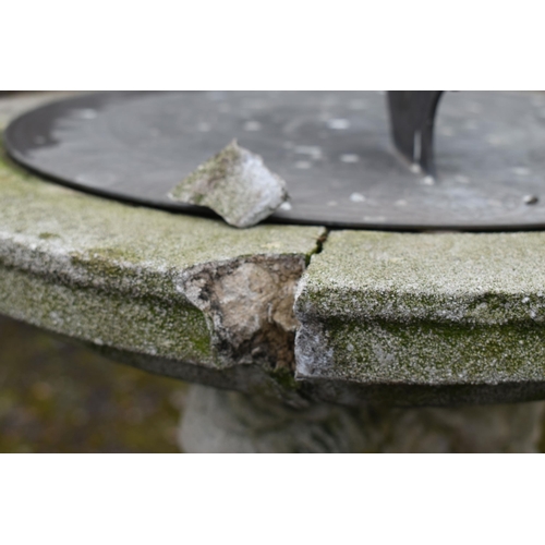 1005 - A LARGE WEATHERED COMPOSITE SUN DIAL, depicting three nude putto's holding the top aloft, on a squar... 