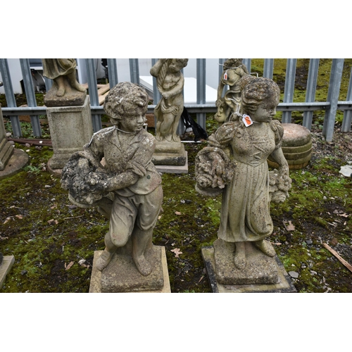 1009 - TWO WEATHERED GARDEN FIGURES, of a boy and girl, max height 75cm (condition report: no cracks or dam... 