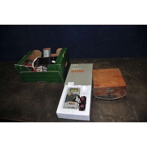 1054 - A TRAY CONTAINING ELECTRICAL TEST EQUIPMENT including a boxed Fluke 8024B multimeter, two Comark 900... 