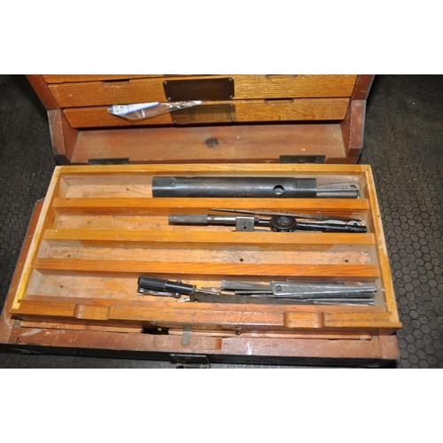 1058 - A MILITARY WOODEN TOOL CHEST marked for Reamers and Plug gauges containing round and square bar, nut... 