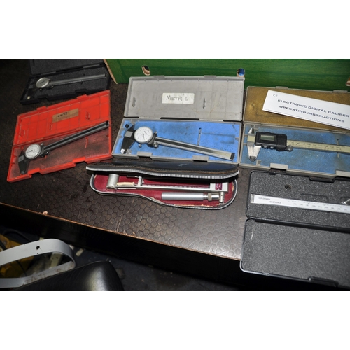 1067 - A TRAY CONTAINING TEST EQUIPMENT including digital and dial vernier calipers by Digimatic, Rabone an... 