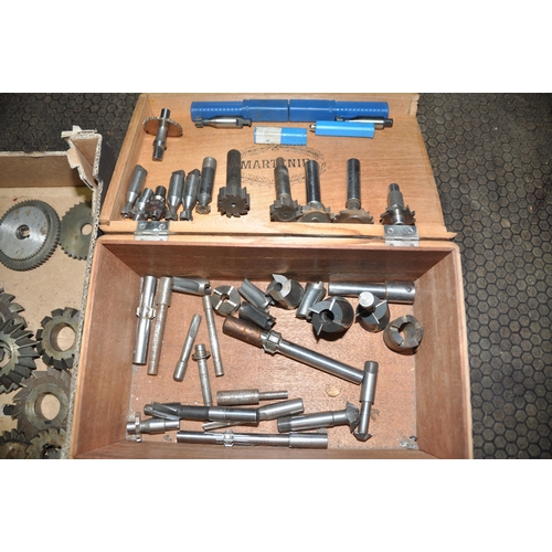 1076 - A BOX AND A TRAY CONTAINING MILLING HEAD CUTTERS