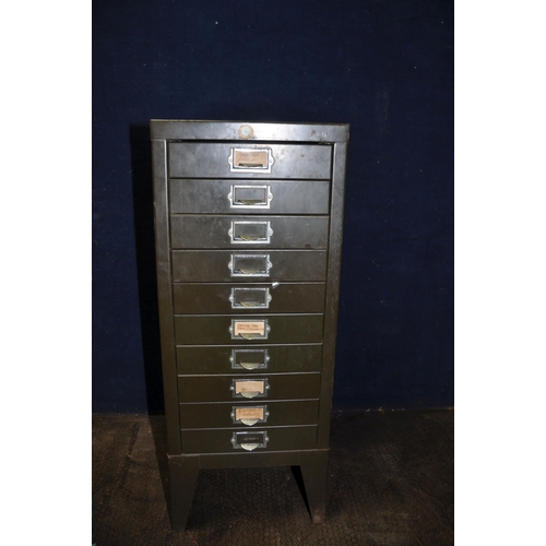 1094 - A VINTAGE METAL CHEST OF TEN FILE DRAWERS containing screws, nuts and bolts, and electrical fixings ... 