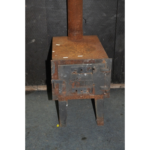 1111 - A 'WILDO' SOLID FUEL WORKSHOP STOVE with 155cm flue, fire box width 30cm depth 45cm height on legs 4... 