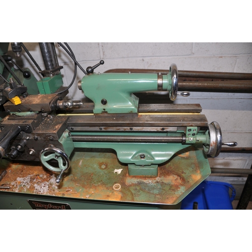 1129 - A MYFORD SUPER 7 METALWORKING LATHE, with 65cm bed, three jaw chuck, an Emco milling head attachment... 