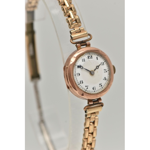 21 - A LADIES 9CT GOLD WRISTWATCH, manual wind, round white dial, Arabic numerals, blue steel hands, in a... 