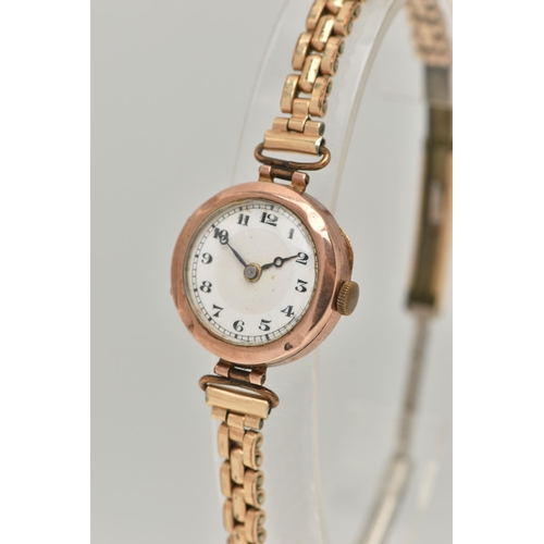 21 - A LADIES 9CT GOLD WRISTWATCH, manual wind, round white dial, Arabic numerals, blue steel hands, in a... 