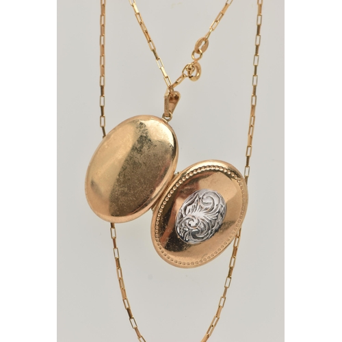 23 - A 9CT GOLD OVAL LOCKET AND CHAIN, bi-colour oval locket with foliate pattern, opens to reveal two va... 