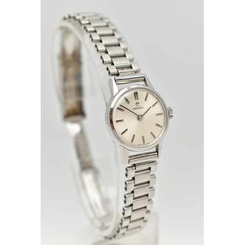 34 - AN OMEGA WRISTWATCH, the silver coloured dial, with black enamel silver coloured hourly applied mark... 