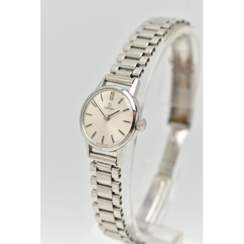 34 - AN OMEGA WRISTWATCH, the silver coloured dial, with black enamel silver coloured hourly applied mark... 