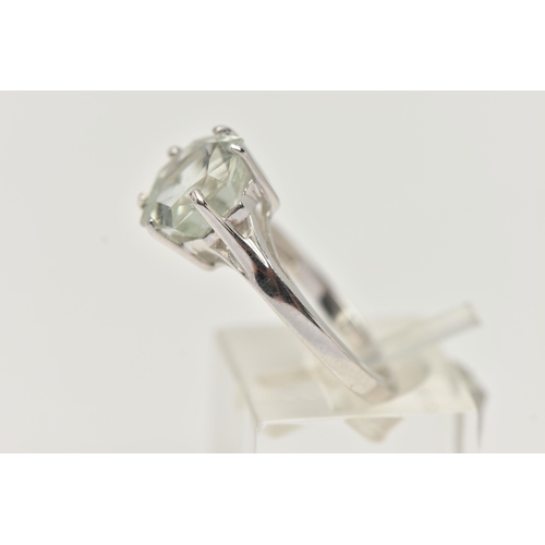 37 - A MODERN 9CT WHITE GOLD BERYL SINGLE STONE RING, set with a hexagonal shaped mixed cut pale green be... 