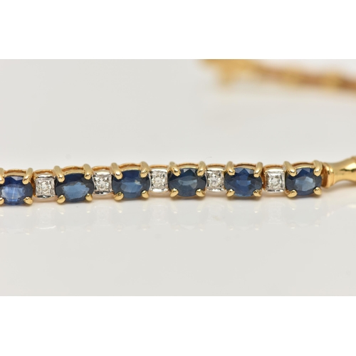 8 - A SAPPHIRE AND DIAMOND BRACELET, designed as a central section of ten oval cut sapphires interspaced... 