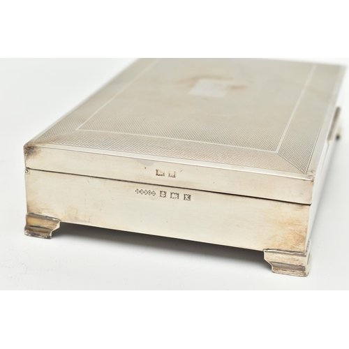 101 - AN ELIZABETH II SILVER CIGARETTE BOX, rectangular engine turned pattern box with vacant cartouche, r... 