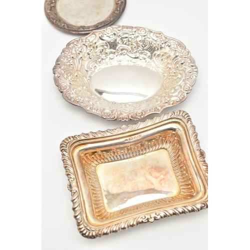 103 - THREE SILVER BONBON DISHES, the first of an oval floral and foliate embossed design, hallmarked 'Joh... 