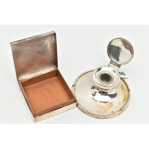 105 - A SILVER CAPSTAN INK WELL AND A CIGARETTE BOX, circular weighted base ink well with hinged cover, gl... 