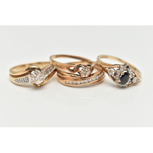 111 - A COLLECTION OF FOUR 9CT YELLOW GOLD GEM SET AND DIAMOND RINGS, to include a diamond crossover band ... 