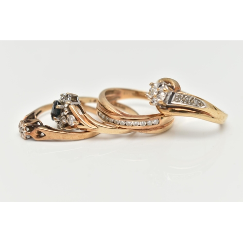 111 - A COLLECTION OF FOUR 9CT YELLOW GOLD GEM SET AND DIAMOND RINGS, to include a diamond crossover band ... 