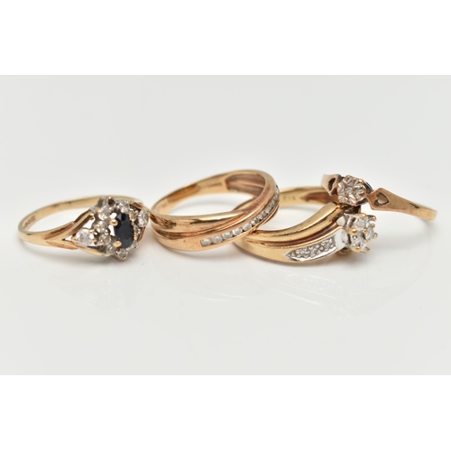 111 - A COLLECTION OF FOUR 9CT YELLOW GOLD GEM SET AND DIAMOND RINGS, to include a diamond crossover band ... 