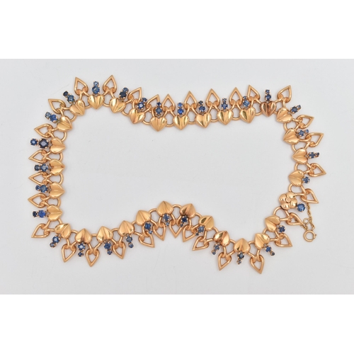 115 - A DECORATIVE SAPPHIRE NECKLACE, designed as a line of heart shape panels each suspending two graduat... 