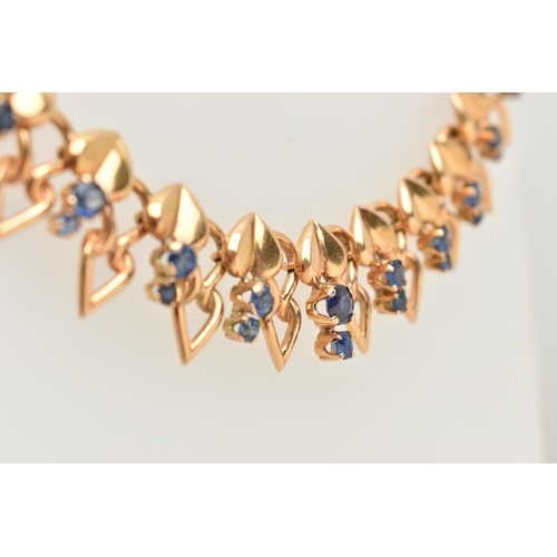 115 - A DECORATIVE SAPPHIRE NECKLACE, designed as a line of heart shape panels each suspending two graduat... 