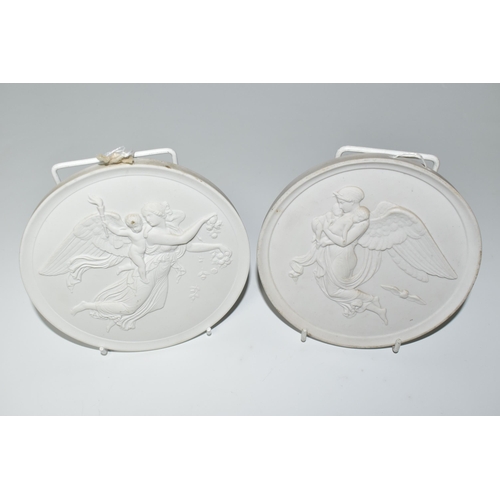 333 - TWO ROYAL COPENHAGEN CIRCULAR BISQUE PLAQUES, depicting angels and cherubs, one bearing painted wave... 