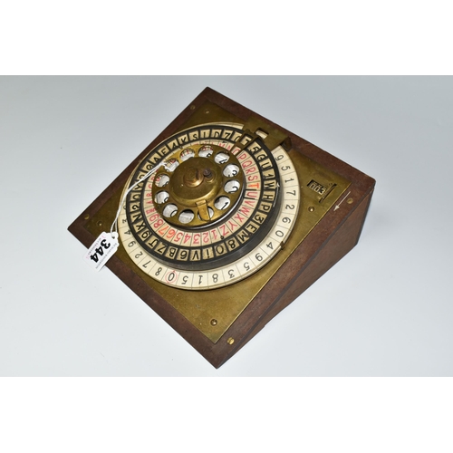 344 - A SCRATCHBUILT DISK CIPHER/CODING MACHINE, with four wheels of letters and numbers, on an angled woo... 