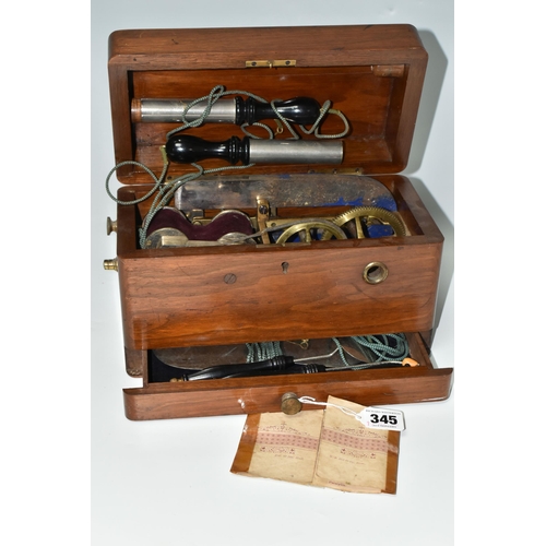 345 - A HAND OPERATED ELECTROTHERAPY MACHINE, in a wooden case, with accessories and 'Brief Directions for... 