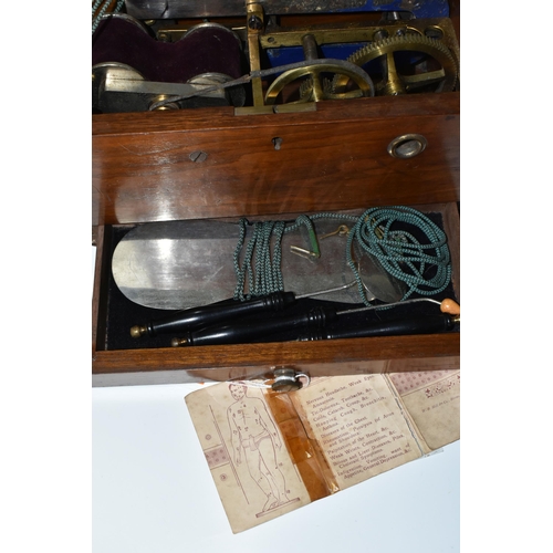 345 - A HAND OPERATED ELECTROTHERAPY MACHINE, in a wooden case, with accessories and 'Brief Directions for... 