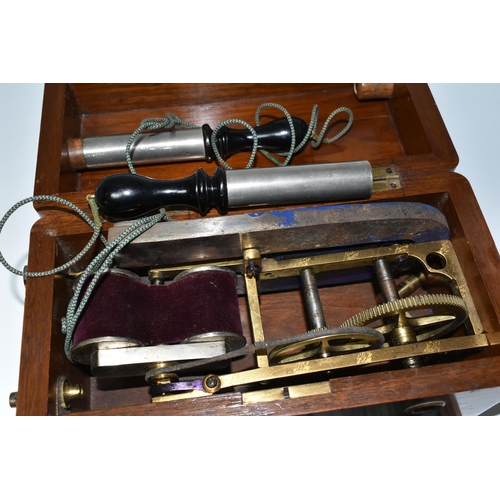 345 - A HAND OPERATED ELECTROTHERAPY MACHINE, in a wooden case, with accessories and 'Brief Directions for... 