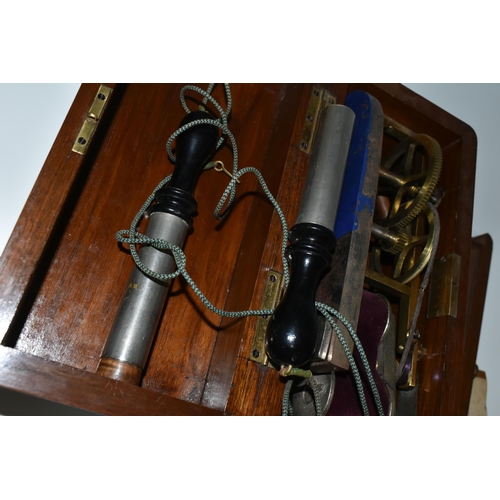 345 - A HAND OPERATED ELECTROTHERAPY MACHINE, in a wooden case, with accessories and 'Brief Directions for... 