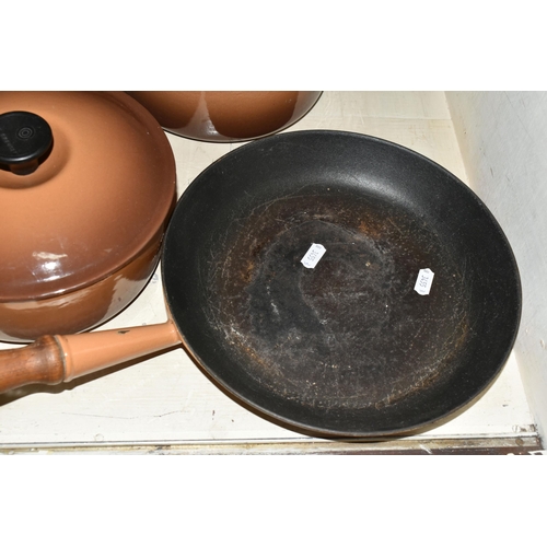 360 - THREE LE CREUSET CAST IRON COOKWARES, comprising 20cm and 22cm saucepans with lids and a 26cm frying... 