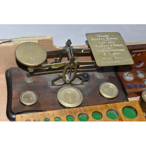 386 - TWO SETS OF POSTAL SCALES, together with three incomplete sets of weights