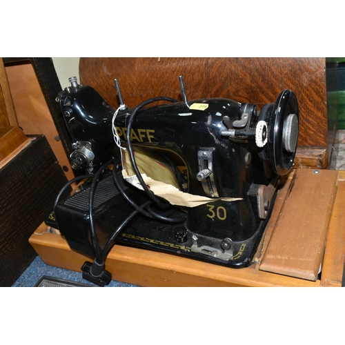 399 - THREE CASED SEWING MACHINES AND A PFAFF ELECTRIC SEWING MACHINE ON A WOODEN BASE AND TWO BOXES OF HA... 