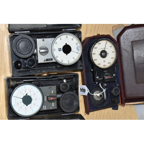 404 - THREE CASED R.P.M. METERS, two by Smiths Industries, the other by Superb of Birmingham, all in used ... 